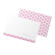 Folded card with pink polka dot design on a white background