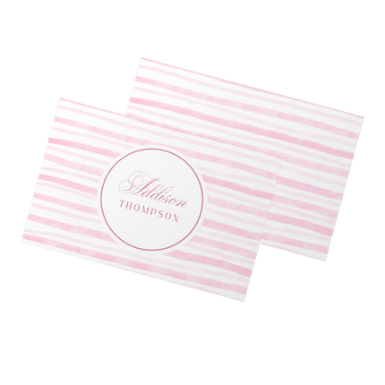 Pink and white striped towel with 'Addison Thompson' name on a white background