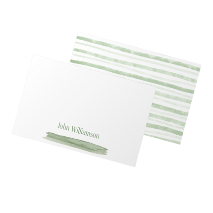 Notecard with green striped cover and white blank side with name written across the bottom on a white background