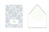Floral-patterned card with a grid-lined envelope on a white background