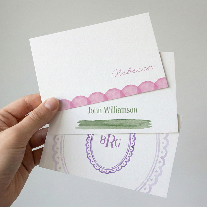 Hand holding 3 different stationery designs